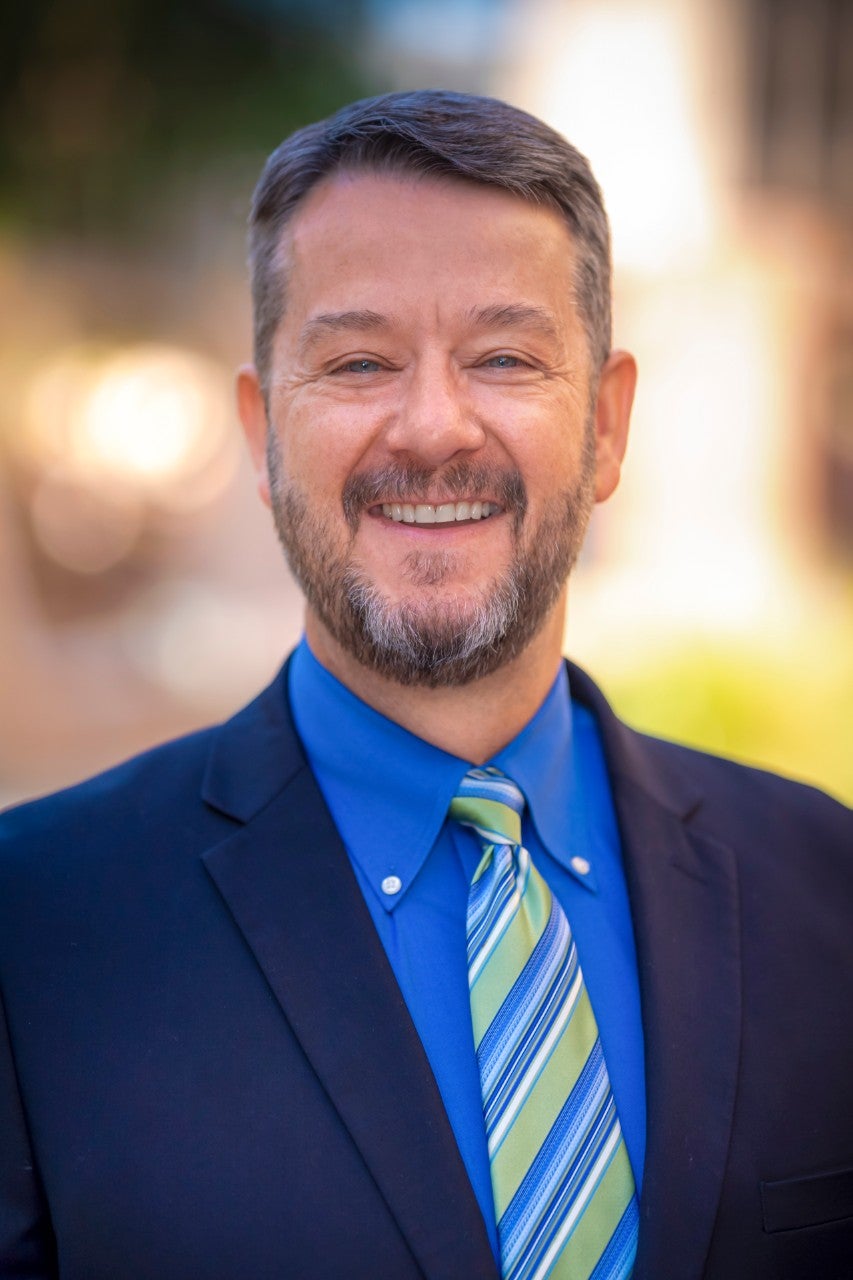 <p>Headshot of Sam McAllen, an Assistant Director</p>