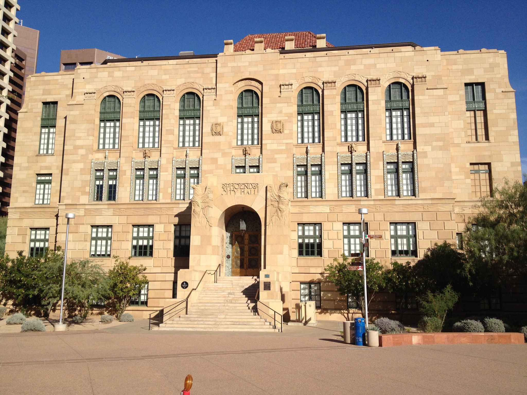 Large two-story stone building with arched windows.