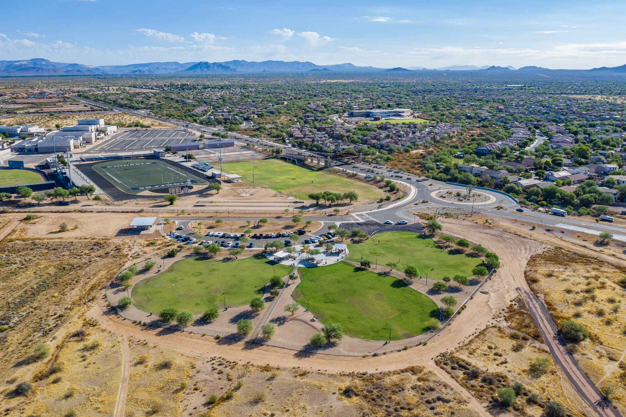 Drone photo of sports fields and a sports complex.