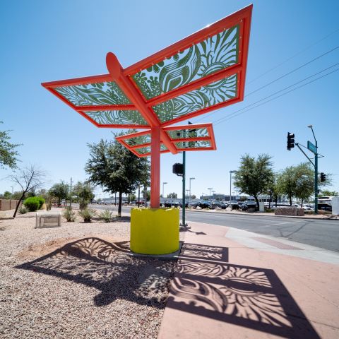 graphic of person standing under potted shade structure