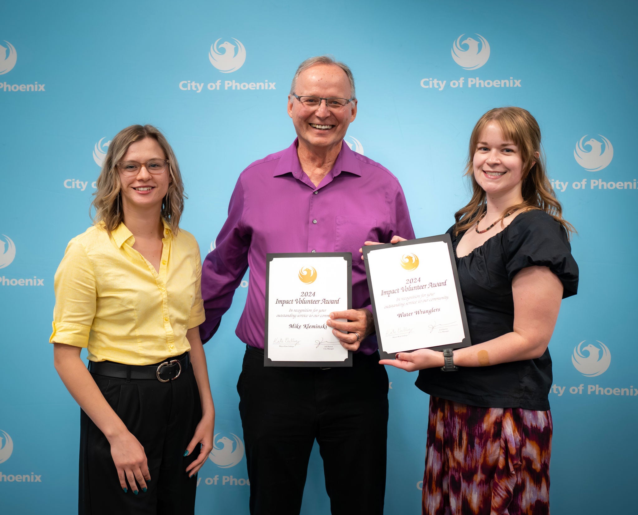 Winners holding awards at 2024 Volunteer Awards