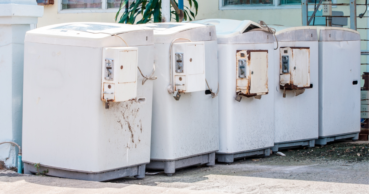 Row of old washing machines