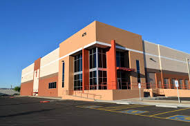 Outside of ​​5th Street & Buckeye Road Project Building, orange building with windows