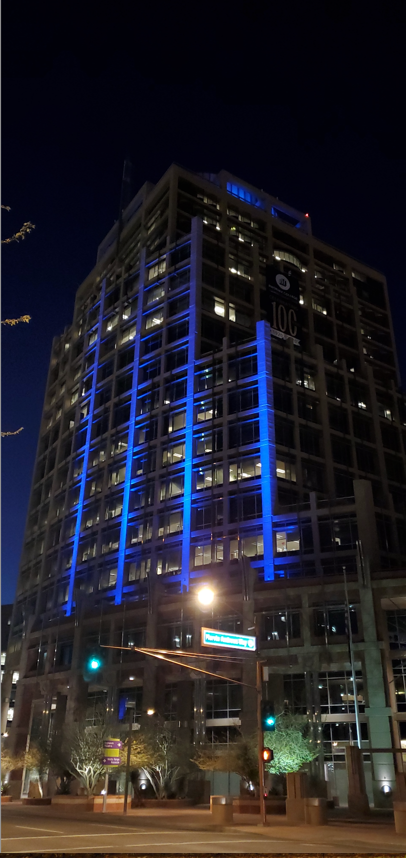 Phoenix City Hall illuminated with blue lights for human trafficking awareness.
