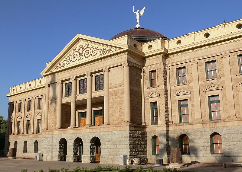 <p>The Arizona State Capitol building. It is a large building built of tan stone.</p>