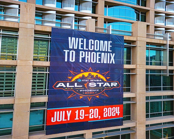 Banner reading 'Welcome to Phoenix' promoting the AT&T WNBA All-Star event on July 19-20, 2024, displayed on a modern building.