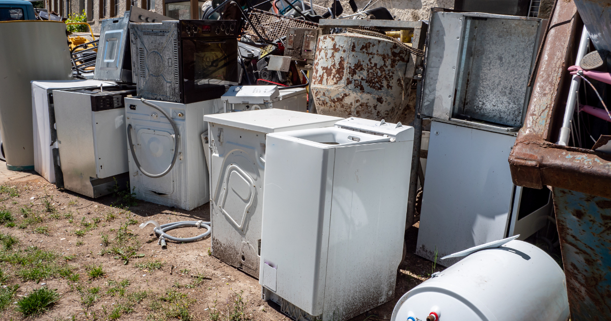Old appliances stacked outside