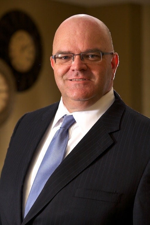 Public Defender David Ward. He is wearing a suit and glasses.