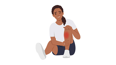 Illustration of a hiker sitting and grimacing over an injury on their leg.