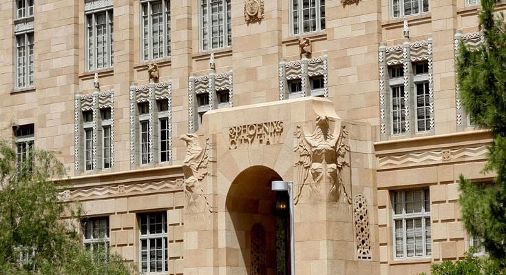An exterior photo of the entrance to historic City Hall.