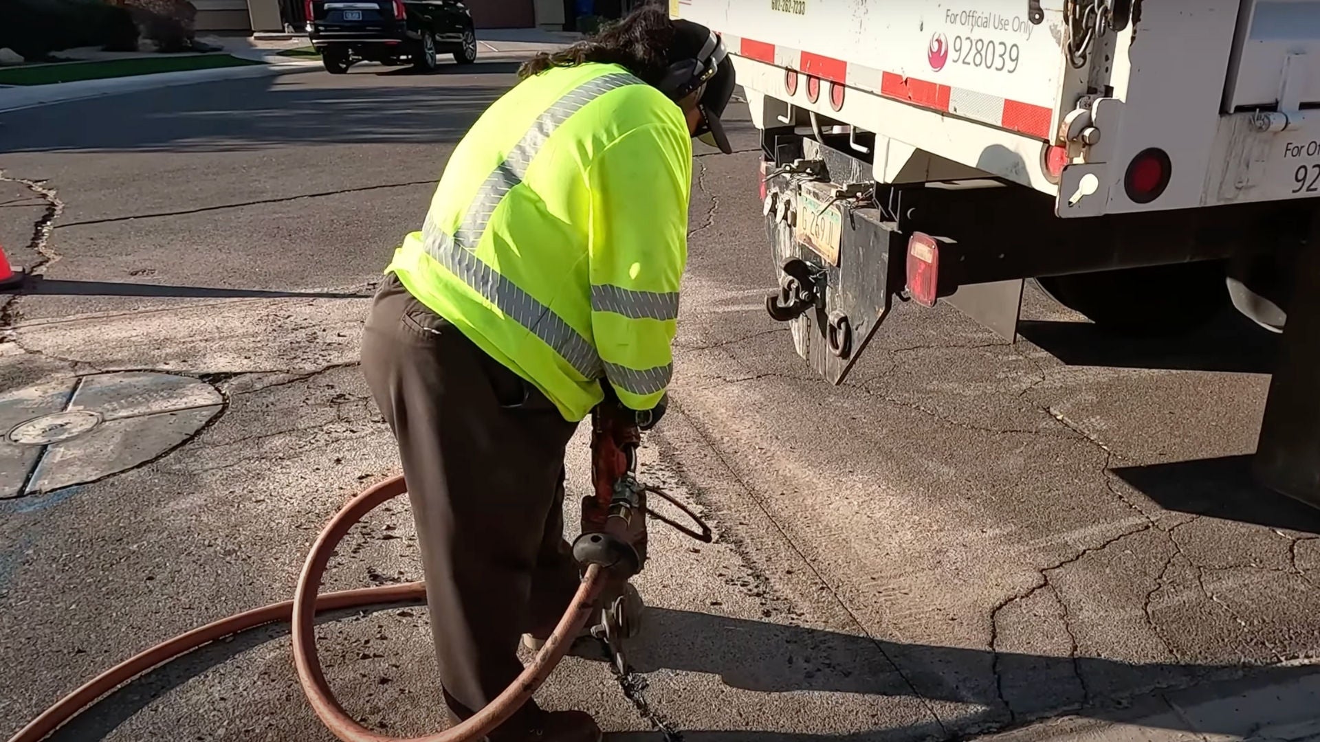 SMW Apprentice using jackhammer on cracked street