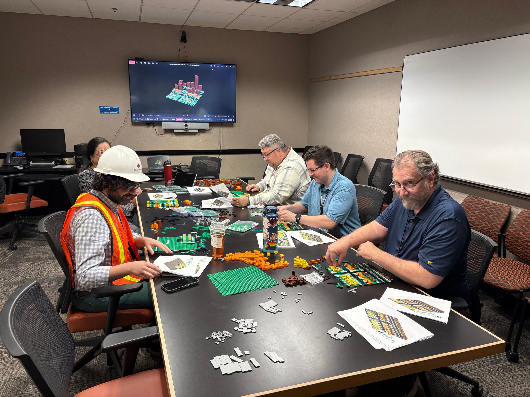 Planning staff gathered in a conference room creating the development models